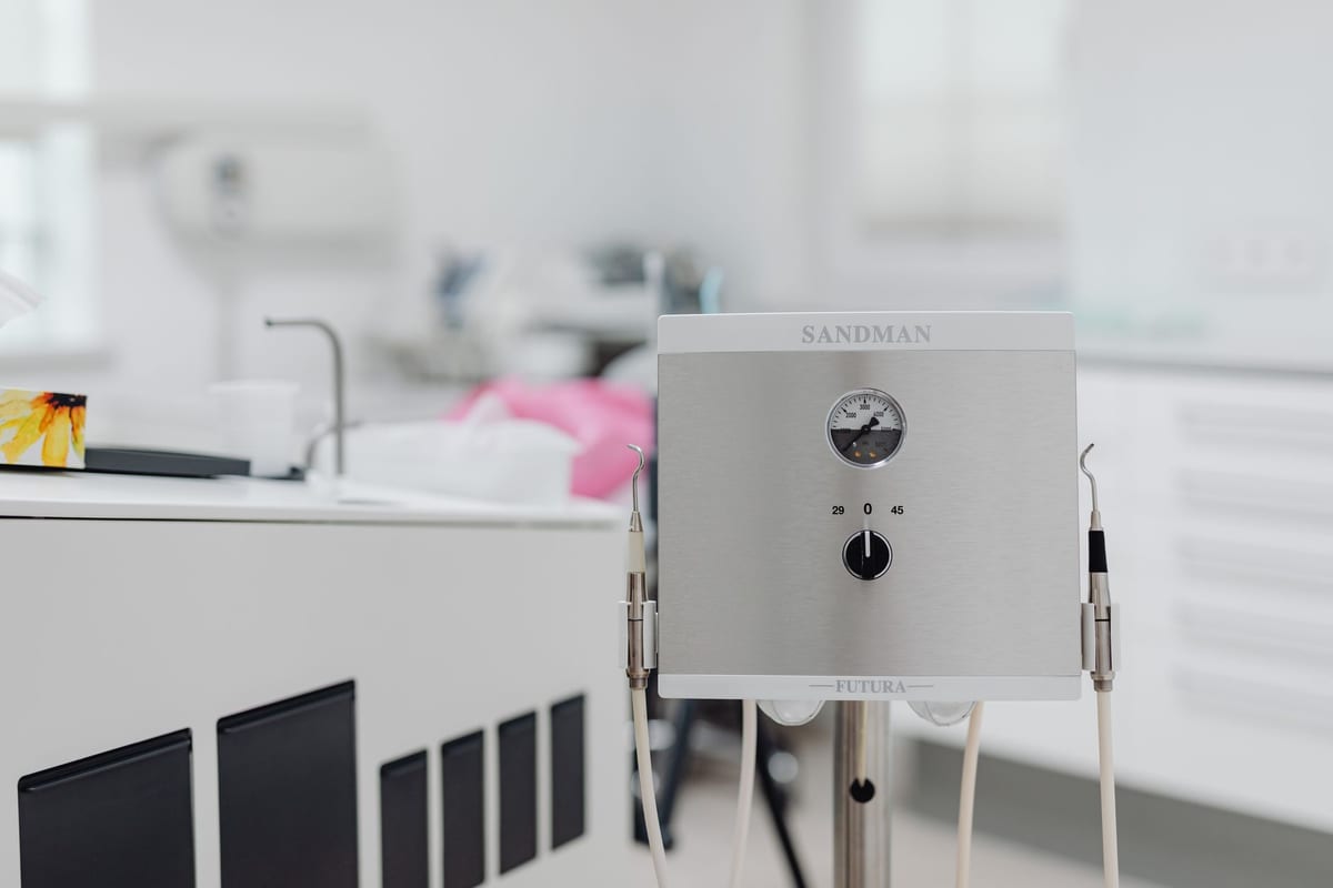 Instrument tray and equipment arm in a clean, sterile operatory
